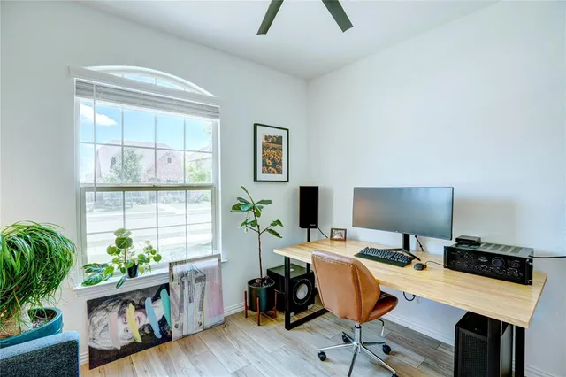 a bedroom with a bed and a potted plant