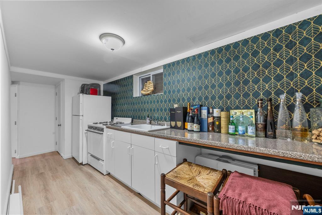 127 Hillside Avenue Cresskill, NJ 07626 - Photo 22 of 42 a kitchen with stainless steel appliances granite countertop a sink and cabinets