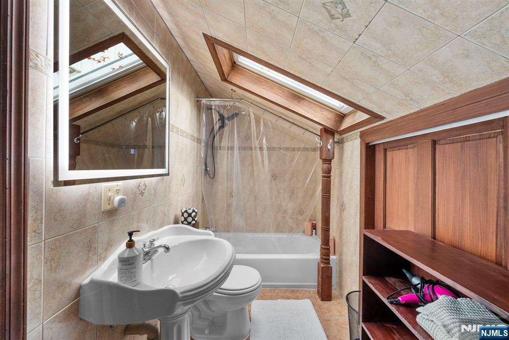 127 Hillside Avenue Cresskill, NJ 07626 - Photo 28 of 42 a bathroom with a sink toilet and shower