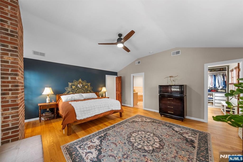 127 Hillside Avenue Cresskill, NJ 07626 - Photo 30 of 42 a bedroom with a bed and wooden floor