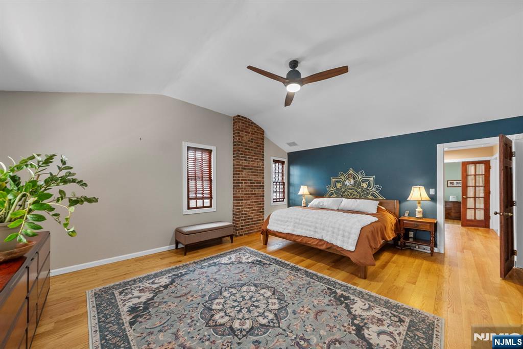 127 Hillside Avenue Cresskill, NJ 07626 - Photo 31 of 42 a bed room with a bed mirror and a chair