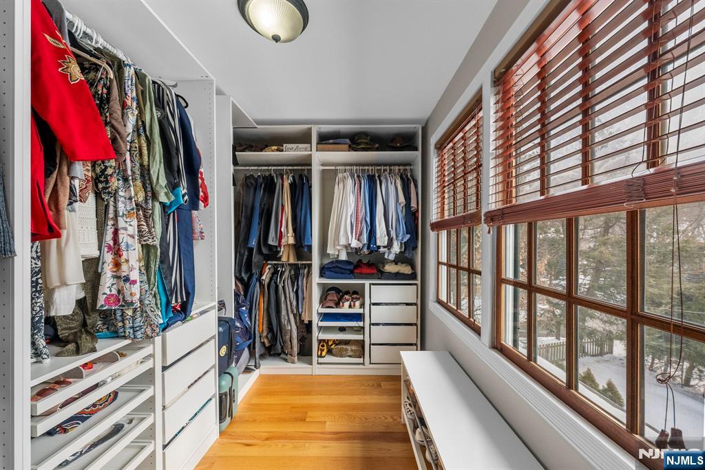 127 Hillside Avenue Cresskill, NJ 07626 - Photo 32 of 42 a view of walk in closet with clothes and shoes
