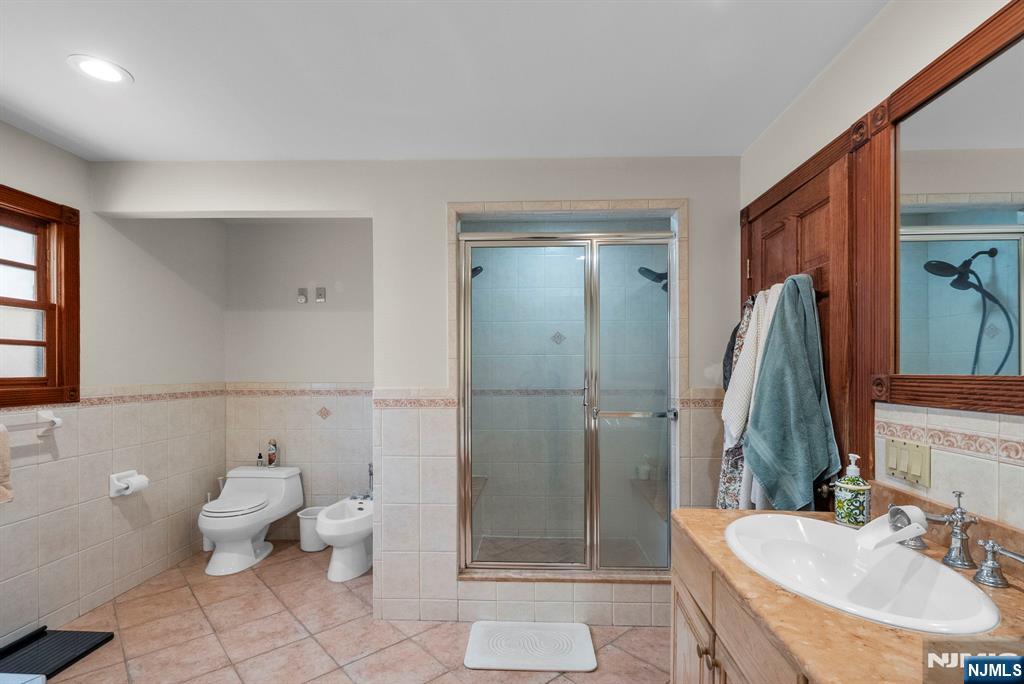 127 Hillside Avenue Cresskill, NJ 07626 - Photo 34 of 42 a bathroom with a sink toilet and shower