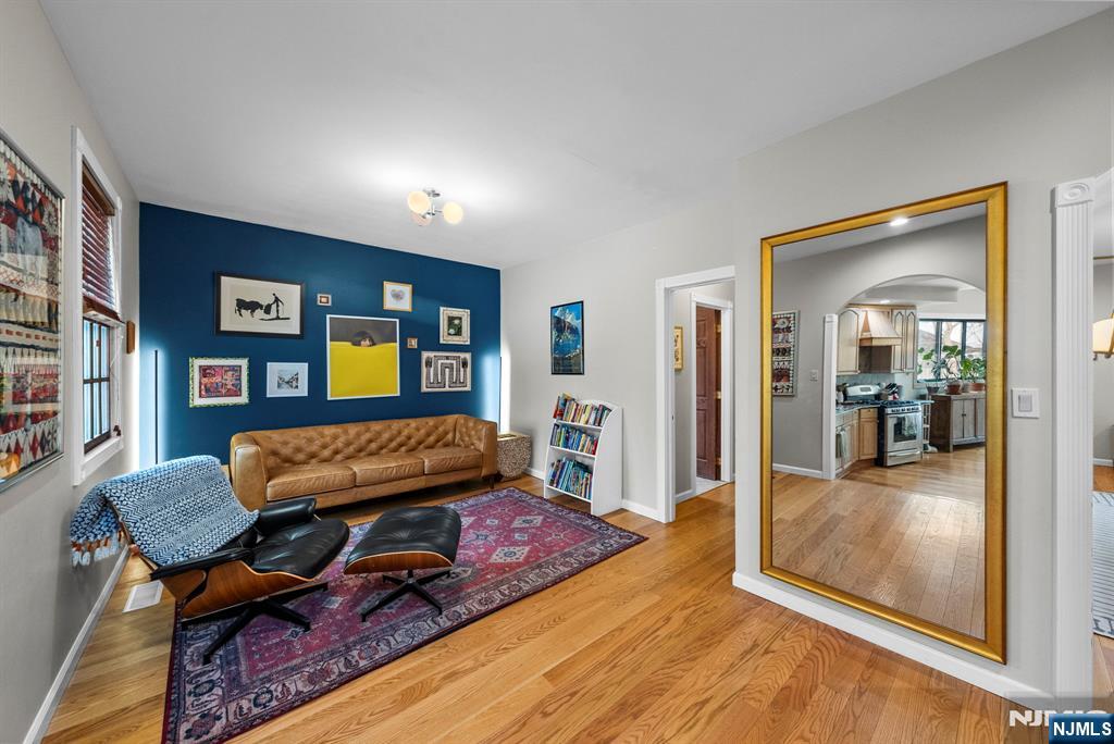 127 Hillside Avenue Cresskill, NJ 07626 - Photo 7 of 42 a living room with furniture and wooden floor