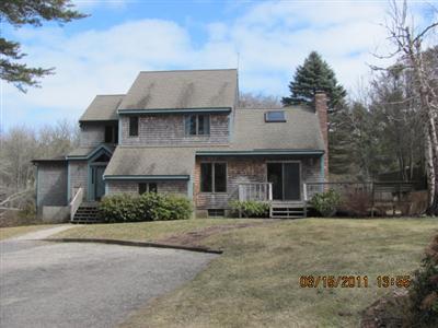 25 Battlefield Road Chatham, MA 02633 - Photo 1 of 16 a front view of a house with a garden
