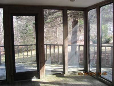 25 Battlefield Road Chatham, MA 02633 - Photo 8 of 16 a view of a glass door and a yard from a window