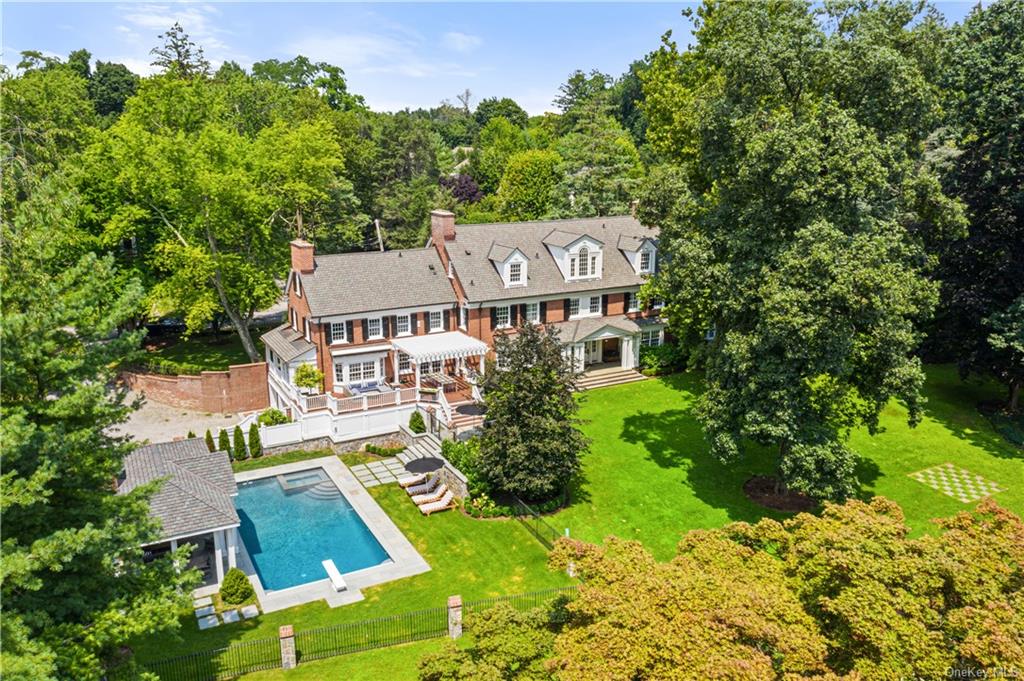 an aerial view of a house with garden space and street view