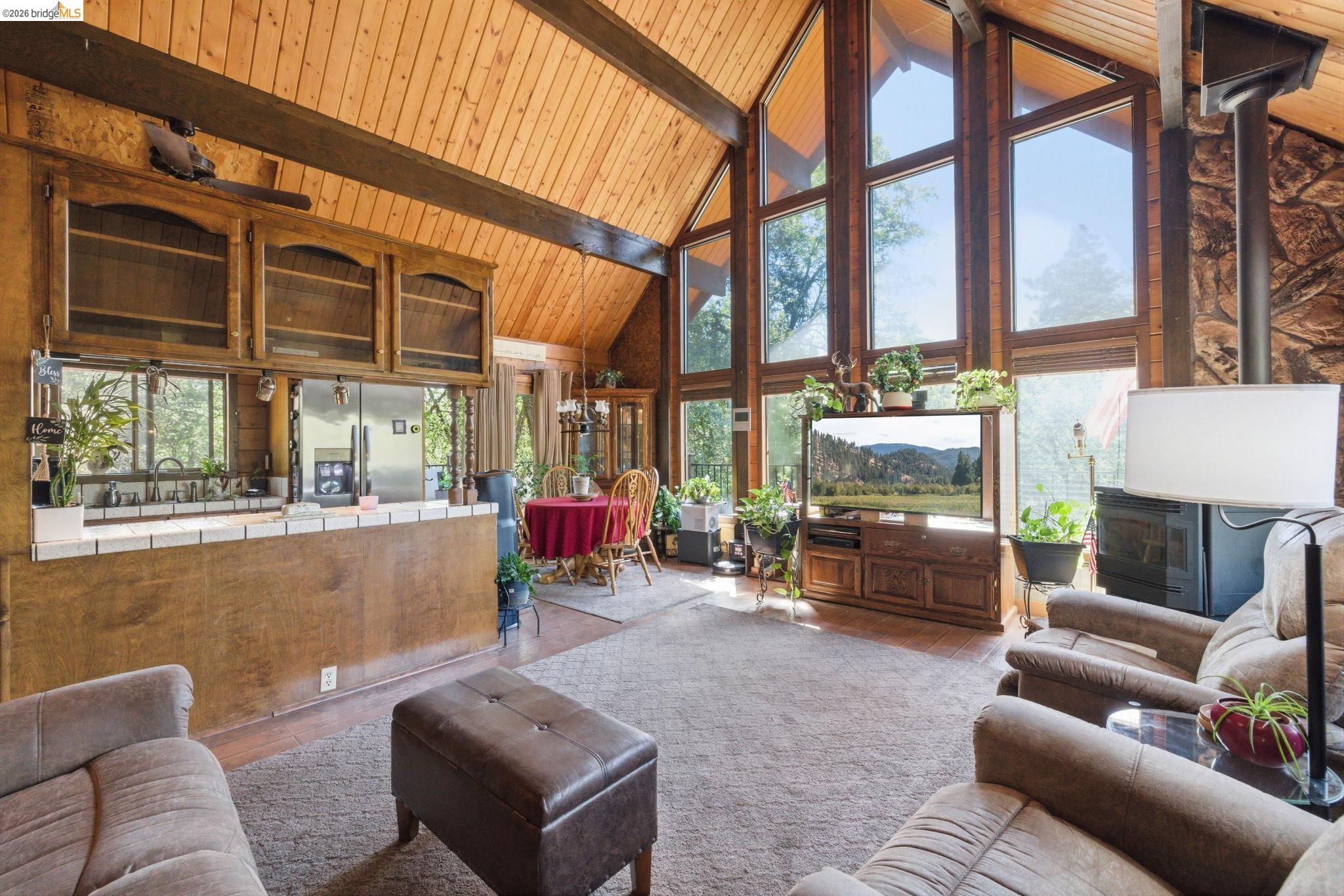 22555 South Fork Road Sonora, CA 95370 - Photo 16 of 35 a living room filled with furniture and a large window