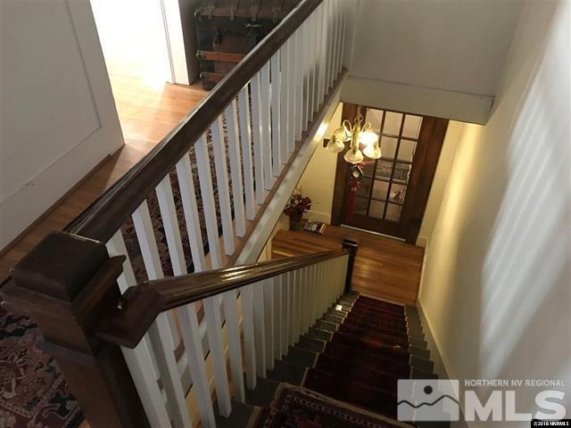 936 Ralston Street Reno, NV 89503 - Photo 8 of 18 a view of staircase with railing and white walls