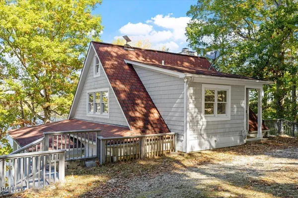 a view of a patio with couches chairs and a potted plant