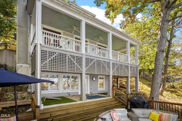 a view of balcony with table and chairs