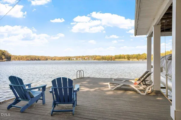 a view of a lake with furniture