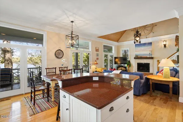 a view of a wooden deck with large windows
