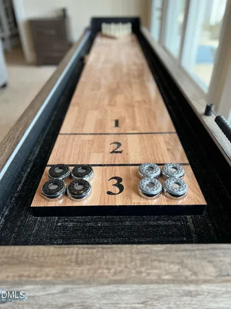 a view of a roof deck with wooden fence and a couple of chairs