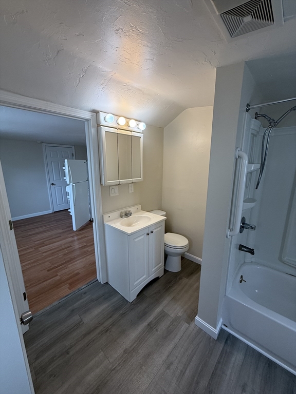 6 Ninth Street, Unit 1 Wareham, MA 02558 - Photo 11 of 15 a bathroom with a sink a toilet and shower