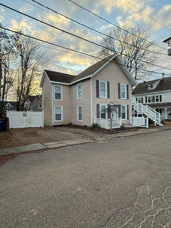 a view of a house with a yard and garage