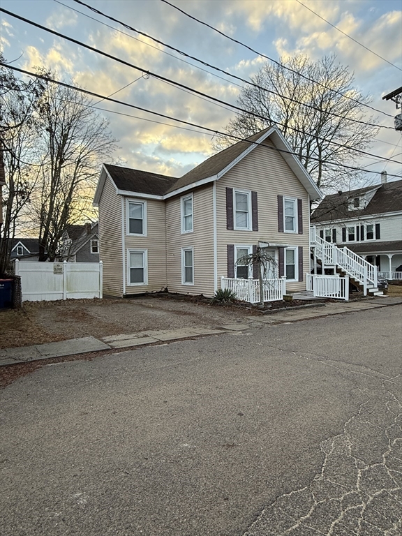 6 Ninth Street, Unit 1 Wareham, MA 02558 - Photo 3 of 15 a view of a house with a yard and garage