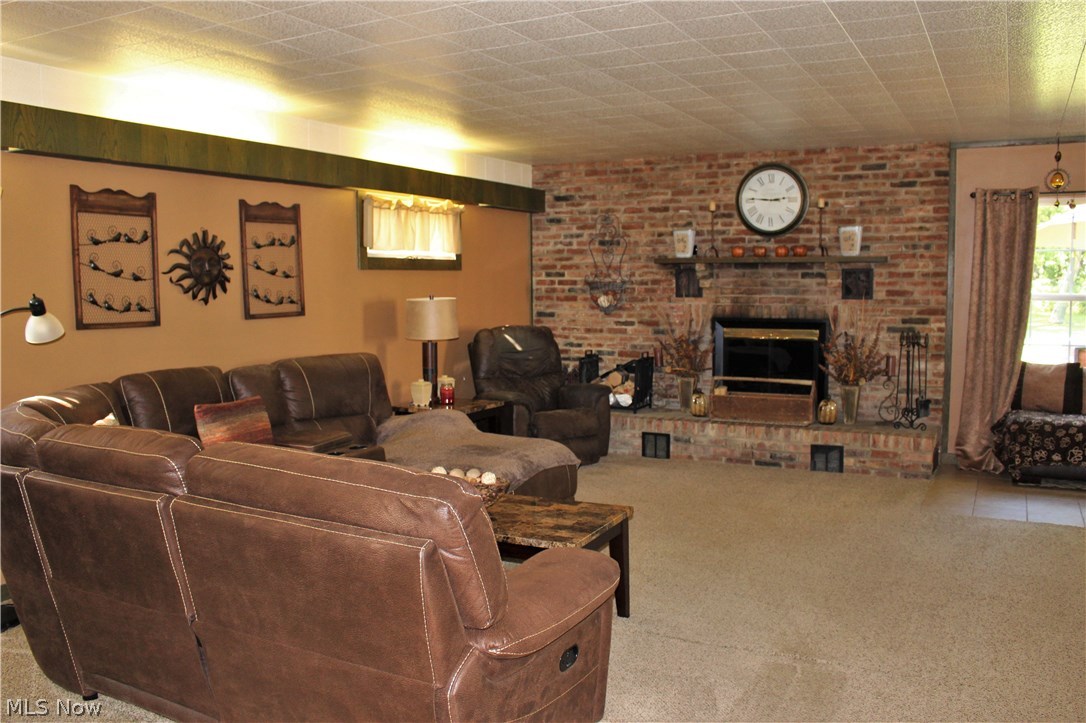 10471 Prouty Road Painesville, OH 44077 - Photo 10 of 33 Enjoy the warmth of the blazing fireplace this fall in your spacious Family Room.
