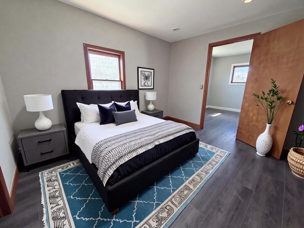 8415 Ravere Street Machesney Park, IL 61115 - Photo 12 of 19 a bedroom with bed and wooden floor