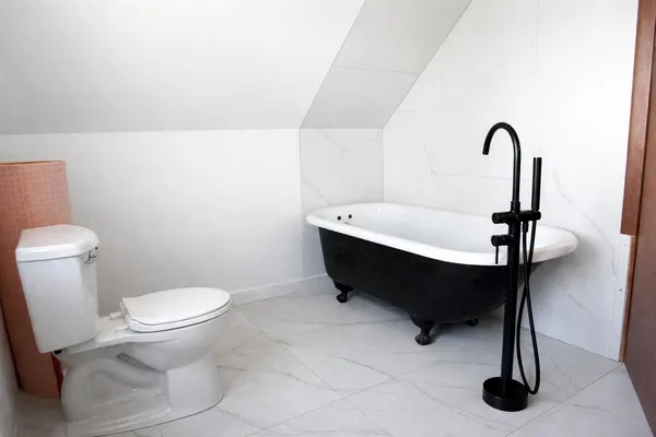 a bathroom with a toilet and a sink