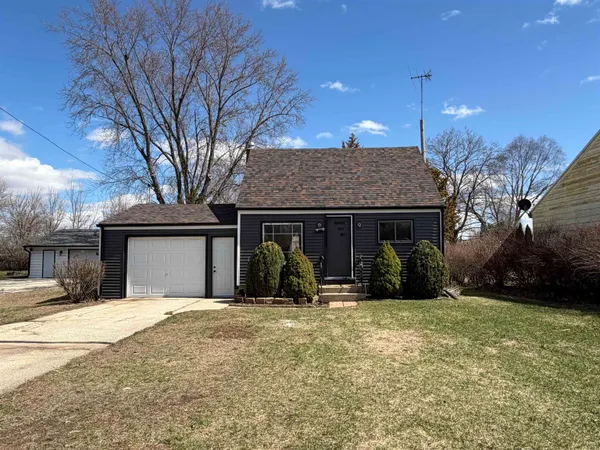 a view of a house with yard and snow