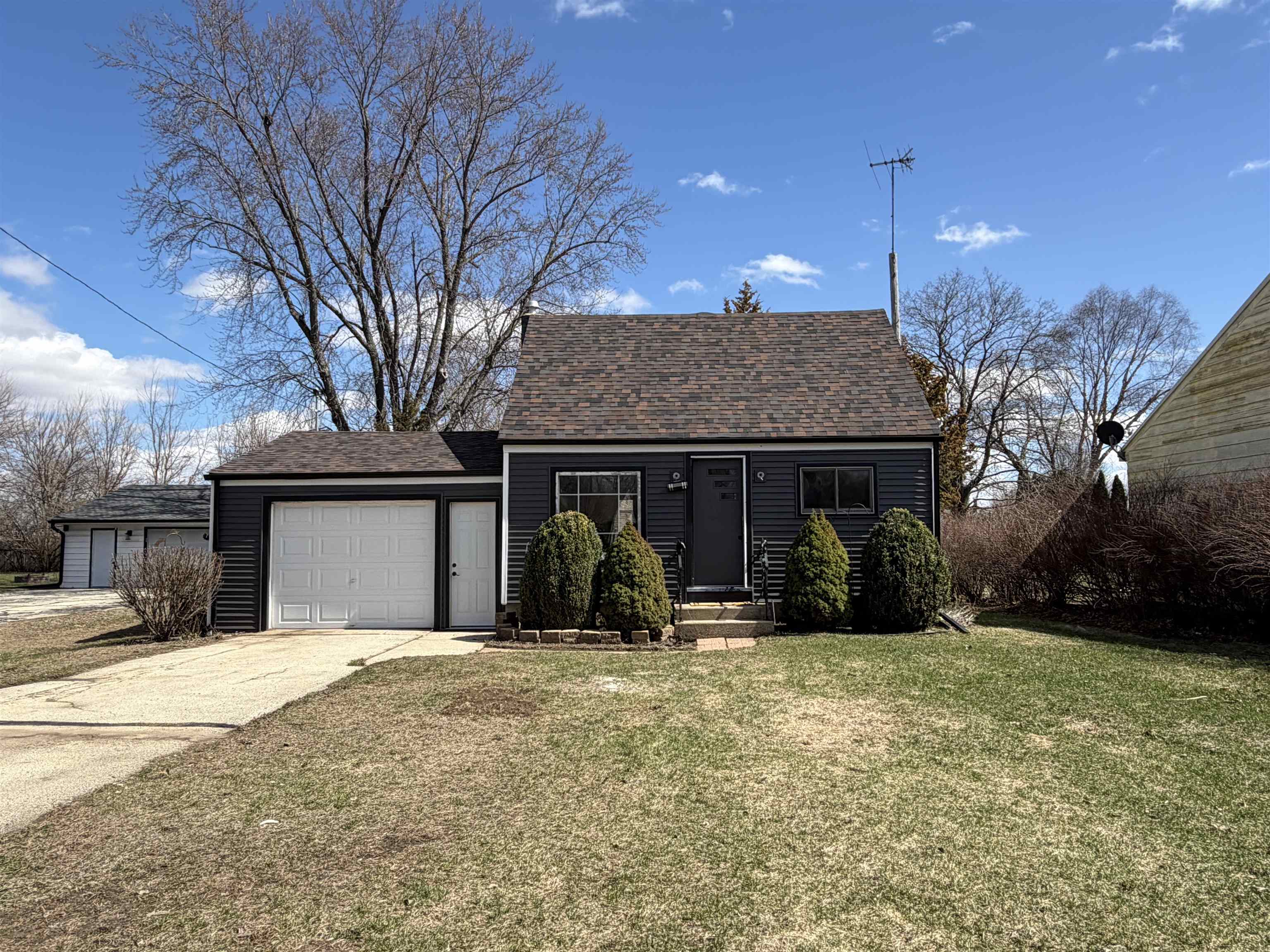8415 Ravere Street Machesney Park, IL 61115 - Photo 3 of 19 a view of a house with yard and snow