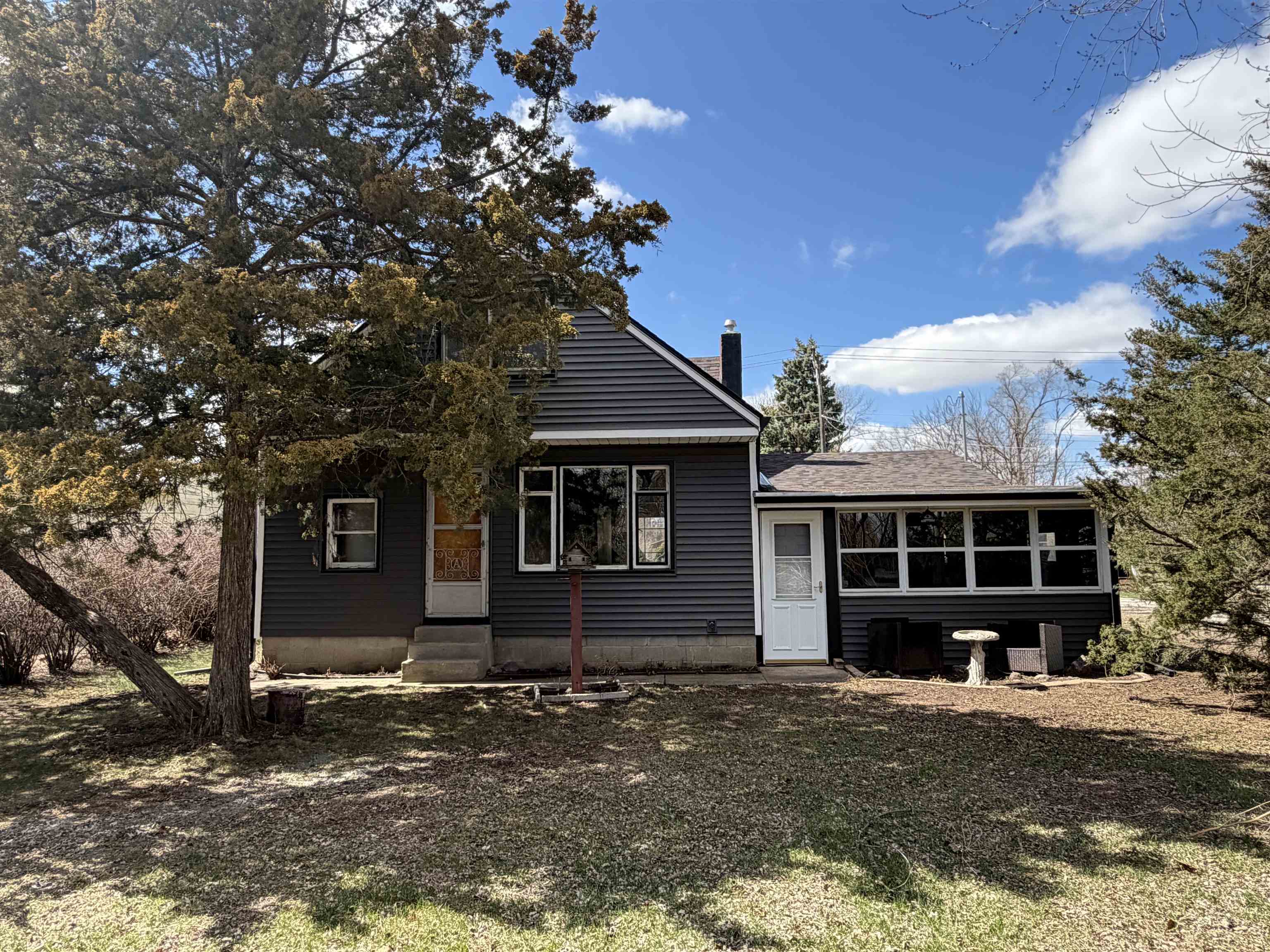 8415 Ravere Street Machesney Park, IL 61115 - Photo 4 of 19 a front view of a house with a yard and garage
