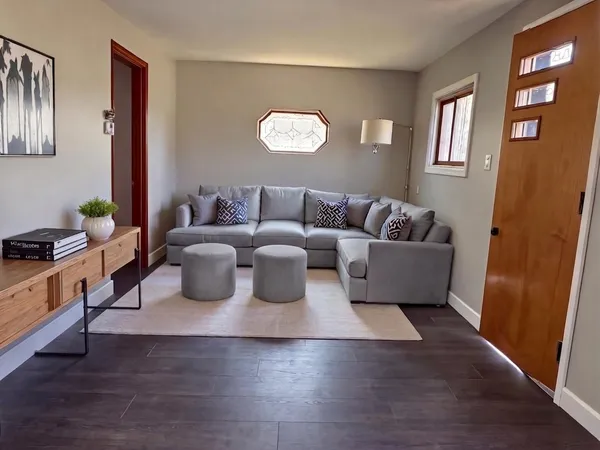 a living room with furniture and a window