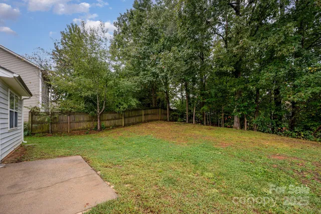 a backyard of a house with lots of green space