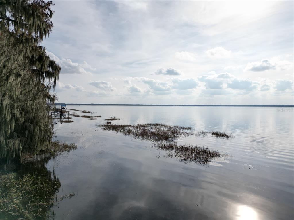 202nd Terrace Hawthorne, FL 32640 - Photo 4 of 10 a view of car parked on road near side of building