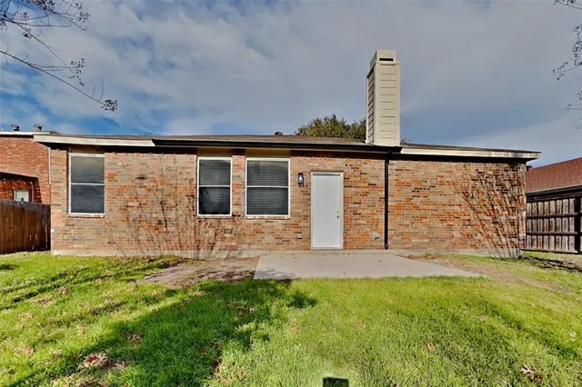 a view of front door of house with yard