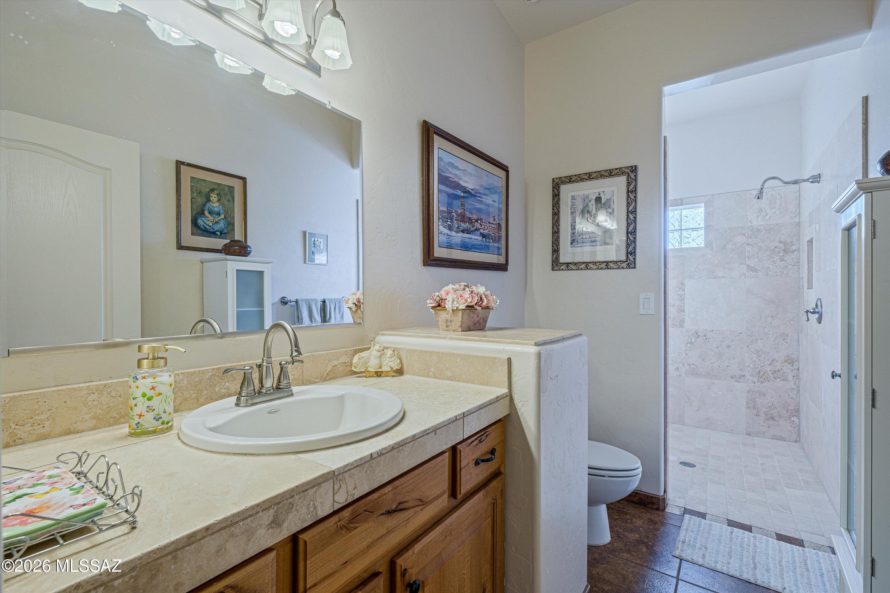4677 East Rail N Road Tucson, AZ 85739 - Photo 25 of 48 Full bathroom off recreation room, next to theatre room, with walk in tiled shower