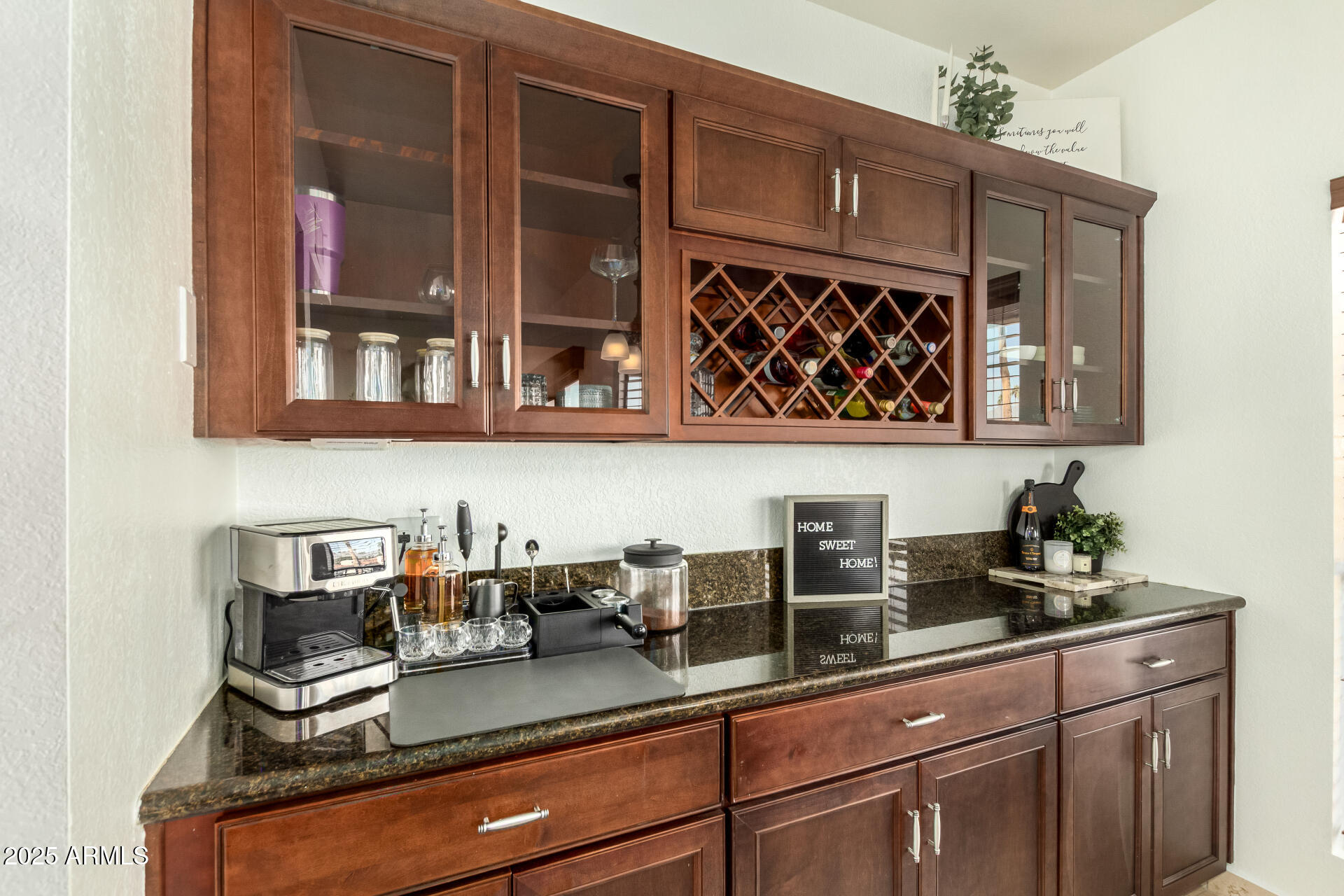 9711 East Mountain View Road, Unit 2514 Scottsdale, AZ 85258 - Photo 12 of 26 a kitchen with a sink a microwave and cabinets