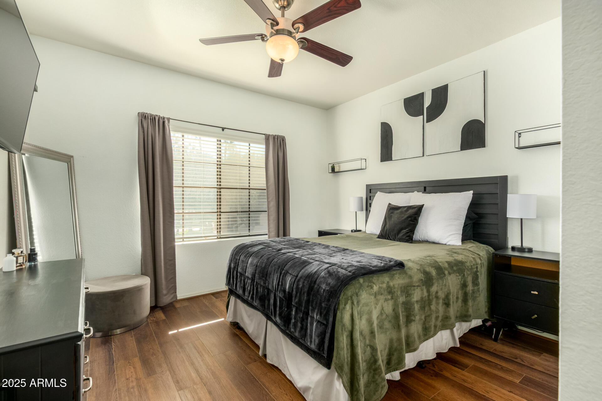 9711 East Mountain View Road, Unit 2514 Scottsdale, AZ 85258 - Photo 13 of 26 a bedroom with a bed and wooden floor