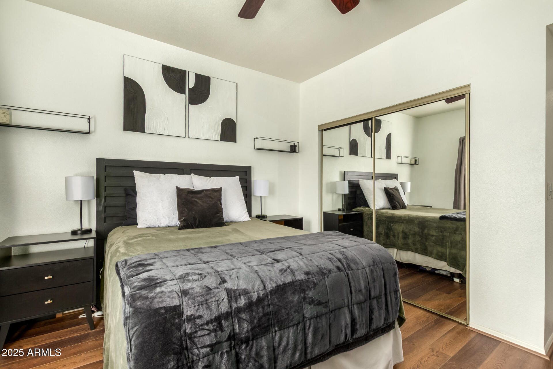 9711 East Mountain View Road, Unit 2514 Scottsdale, AZ 85258 - Photo 14 of 26 a bedroom with a bed and a mirror