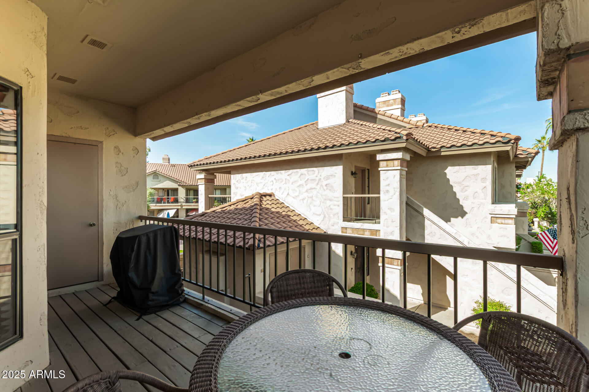 9711 East Mountain View Road, Unit 2514 Scottsdale, AZ 85258 - Photo 17 of 26 a view of a two chairs in the balcony