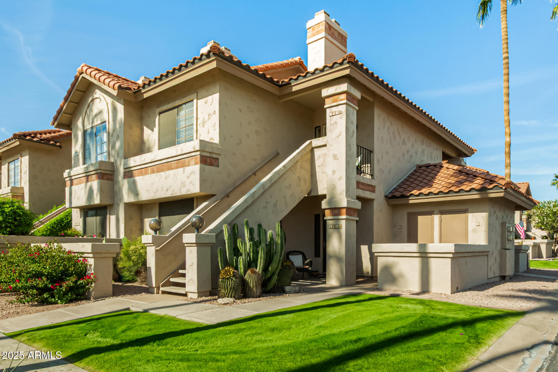 9711 East Mountain View Road, Unit 2514 Scottsdale, AZ 85258 - Photo 2 of 26 a view of a house with yard and deck