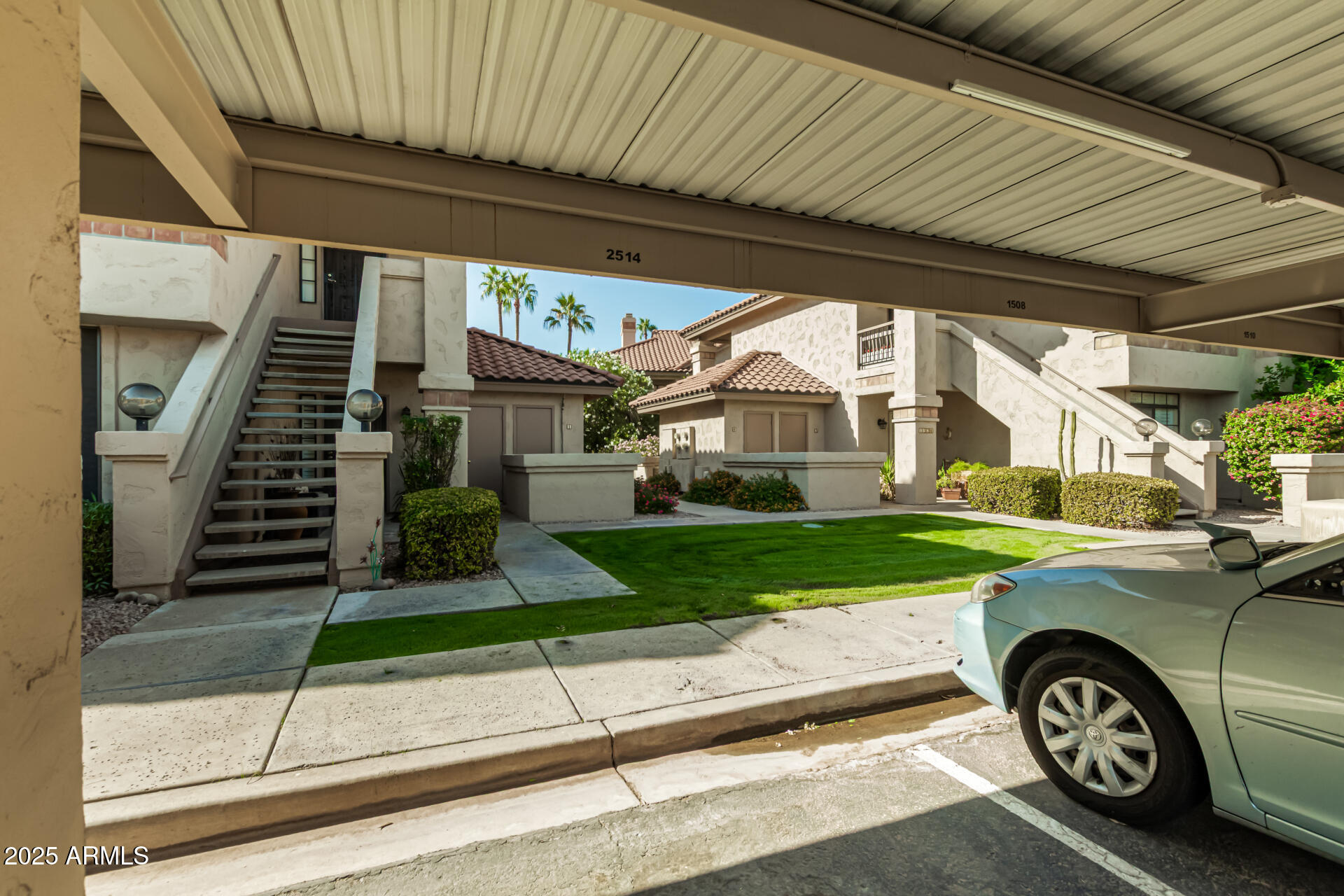 9711 East Mountain View Road, Unit 2514 Scottsdale, AZ 85258 - Photo 21 of 26 a front view of a house with a yard