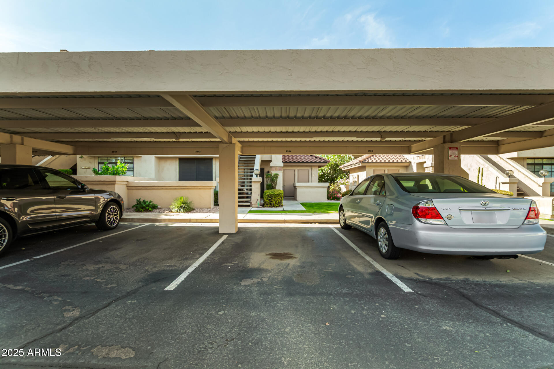 9711 East Mountain View Road, Unit 2514 Scottsdale, AZ 85258 - Photo 22 of 26 a view of parking garage with cars