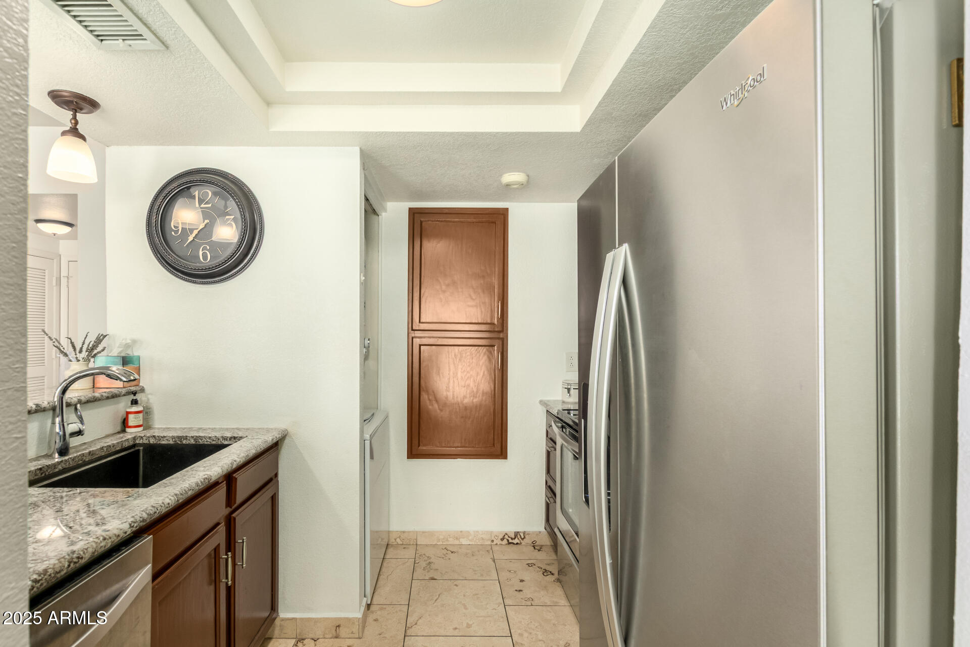 9711 East Mountain View Road, Unit 2514 Scottsdale, AZ 85258 - Photo 8 of 26 a kitchen with stainless steel appliances granite countertop a sink and a refrigerator