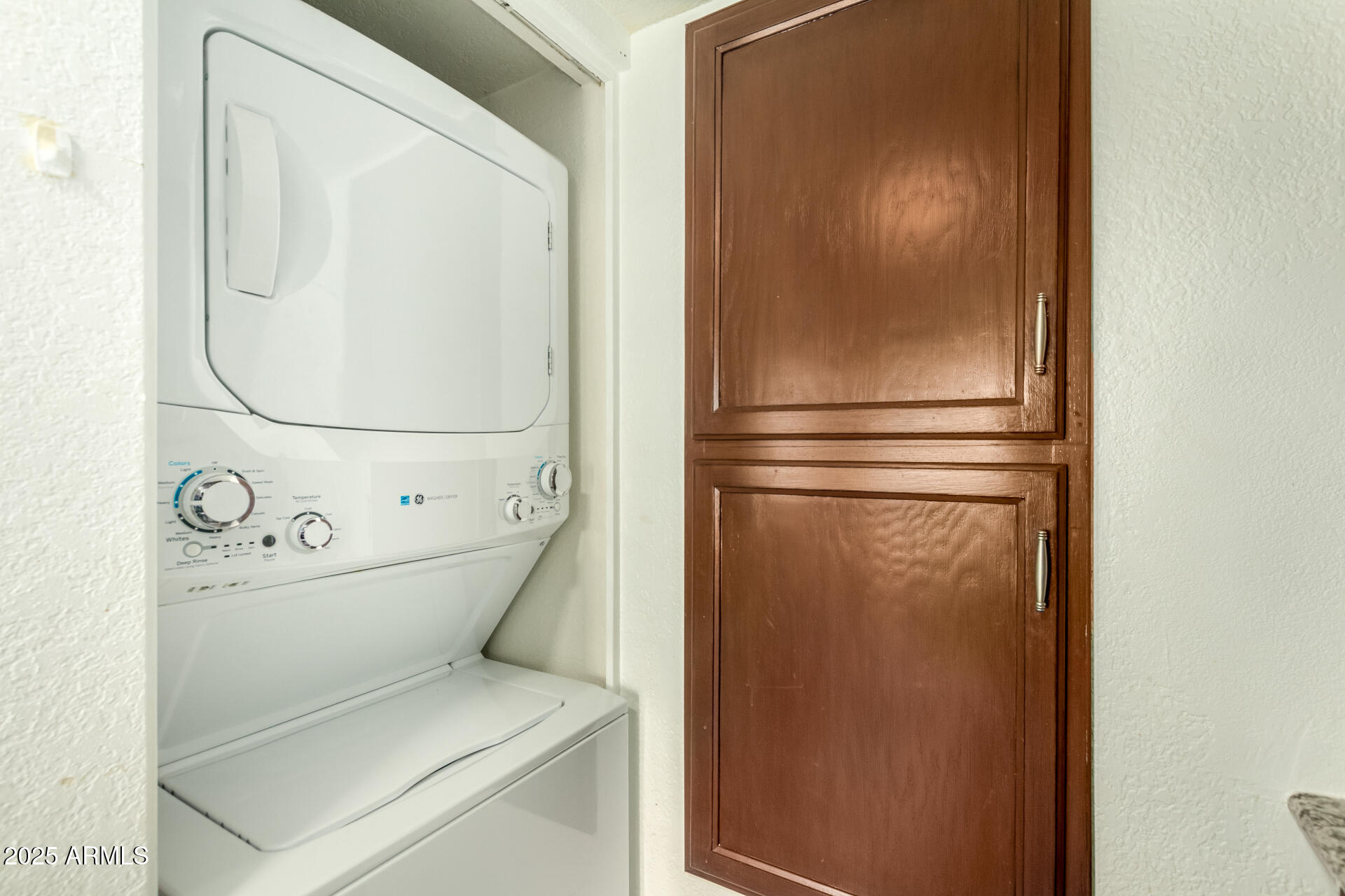 9711 East Mountain View Road, Unit 2514 Scottsdale, AZ 85258 - Photo 10 of 26 a utility room with dryer and washer