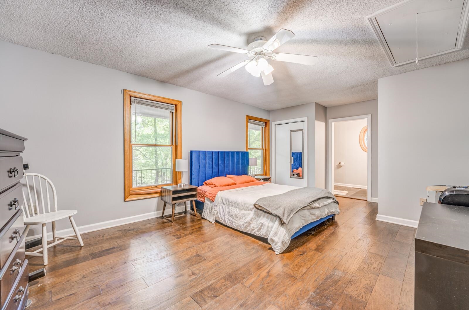 8651 Baylor Road Bartlett, TN 38002 - Photo 13 of 29 a spacious bedroom with a large bed and a chandelier