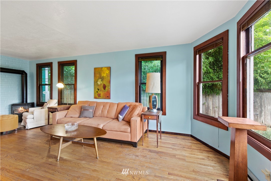 907 North 68th Street Seattle, WA 98103 - Photo 2 of 36 a living room with furniture and a large window