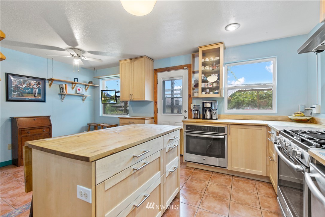 907 North 68th Street Seattle, WA 98103 - Photo 17 of 36 a kitchen with a stove and a sink