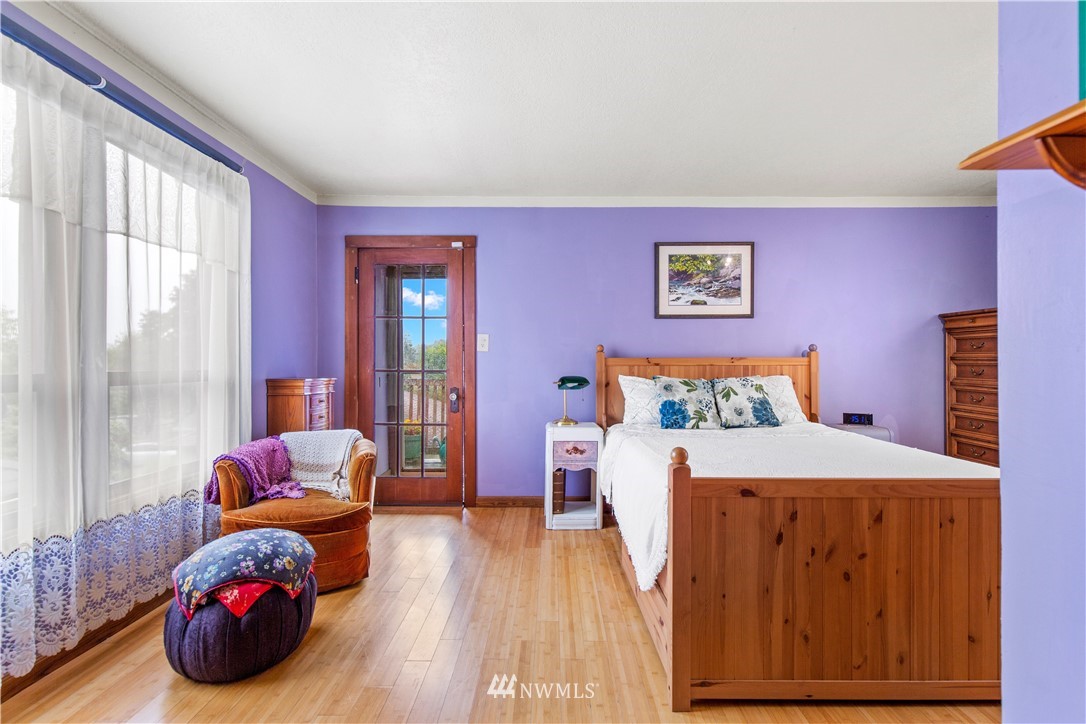 907 North 68th Street Seattle, WA 98103 - Photo 22 of 36 a bedroom with a bed and a couch