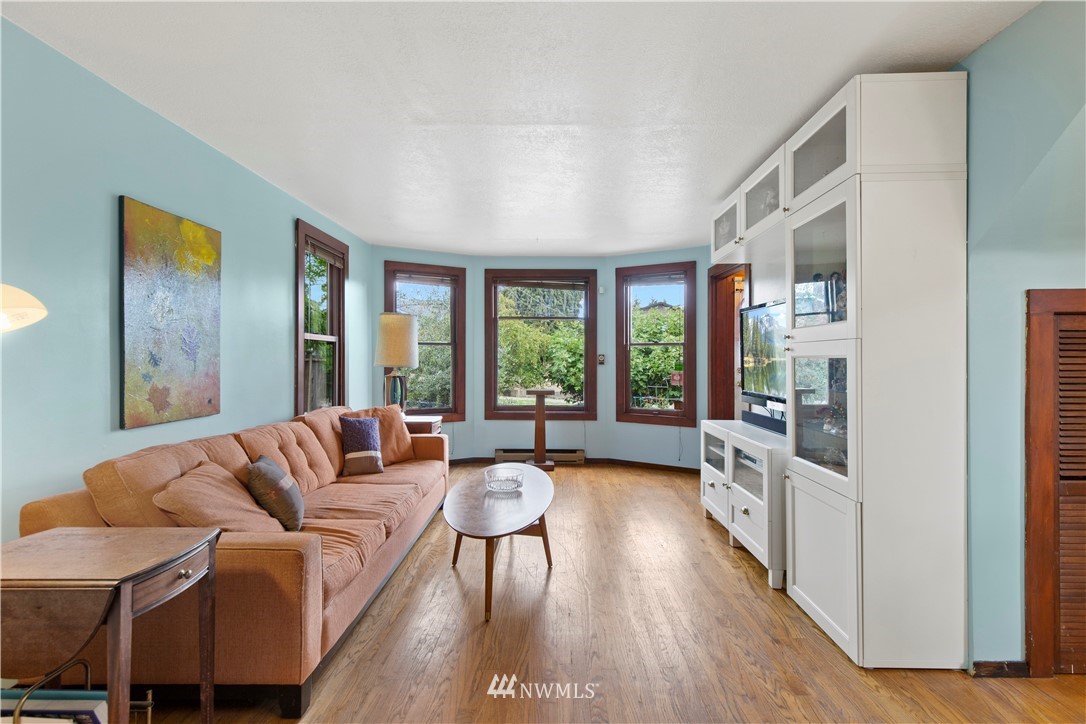 907 North 68th Street Seattle, WA 98103 - Photo 5 of 36 a living room with furniture and a large window