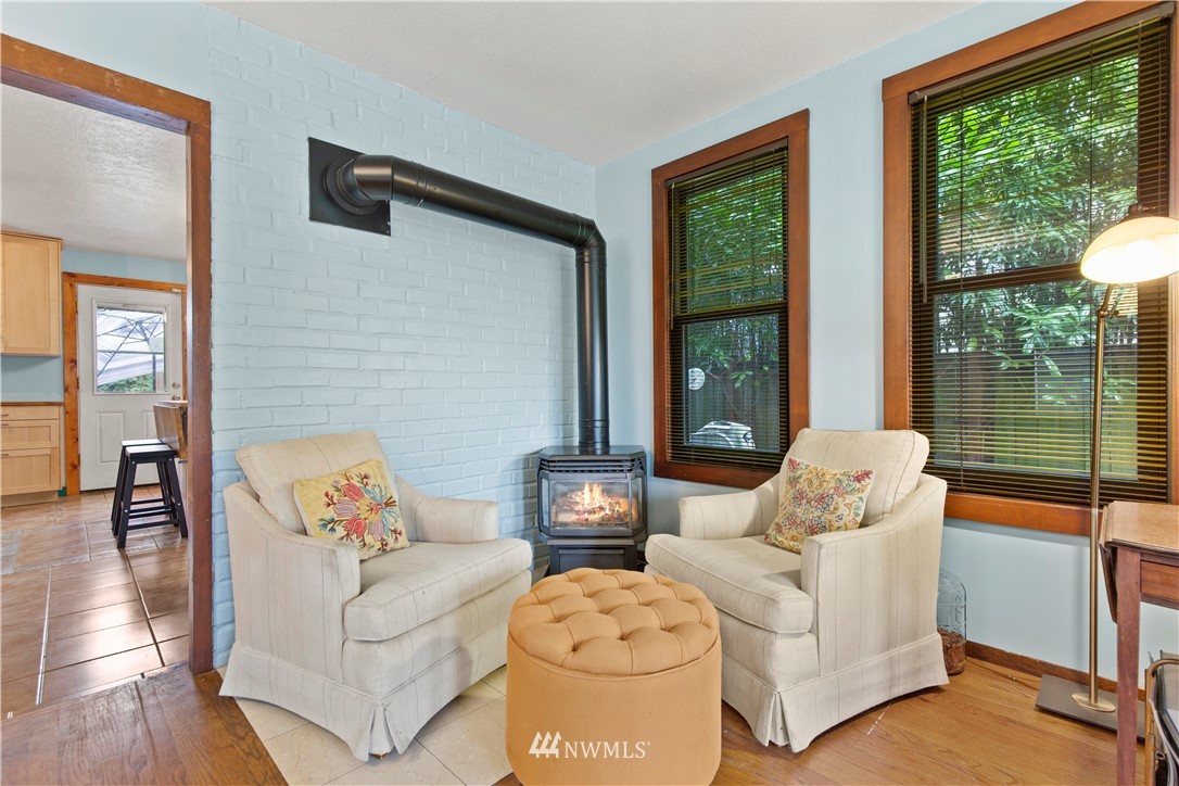 907 North 68th Street Seattle, WA 98103 - Photo 7 of 36 a living room with furniture and a large window