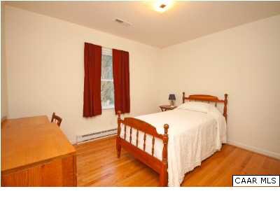 2603 Huntington Road Charlottesville, VA 22901 - Photo 10 of 14 a bedroom with a bed and a night stand