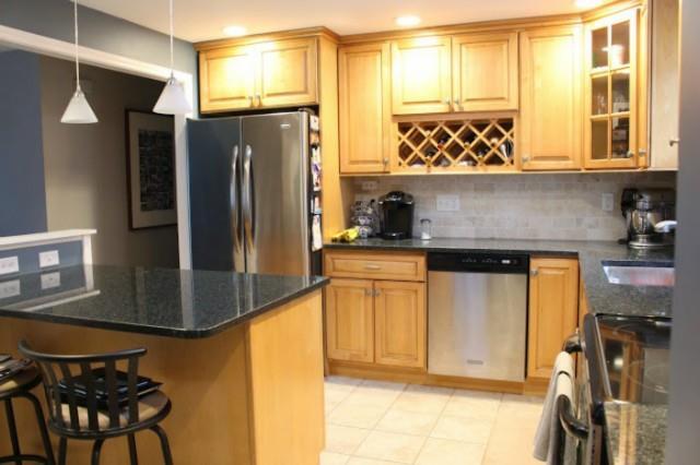 60 Twitchgrass Road Trumbull, CT 06611 - Photo 1 of 1 a kitchen with stainless steel appliances granite countertop a refrigerator and a stove top oven