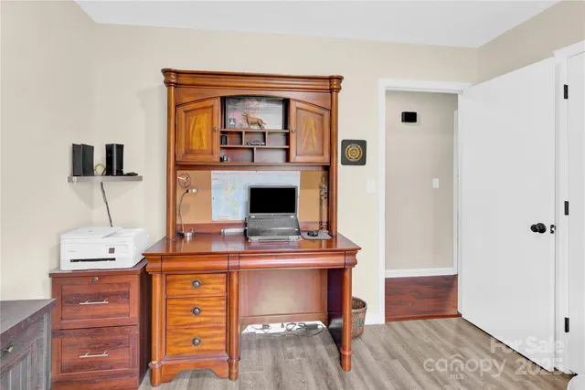 a view of a workspace with furniture